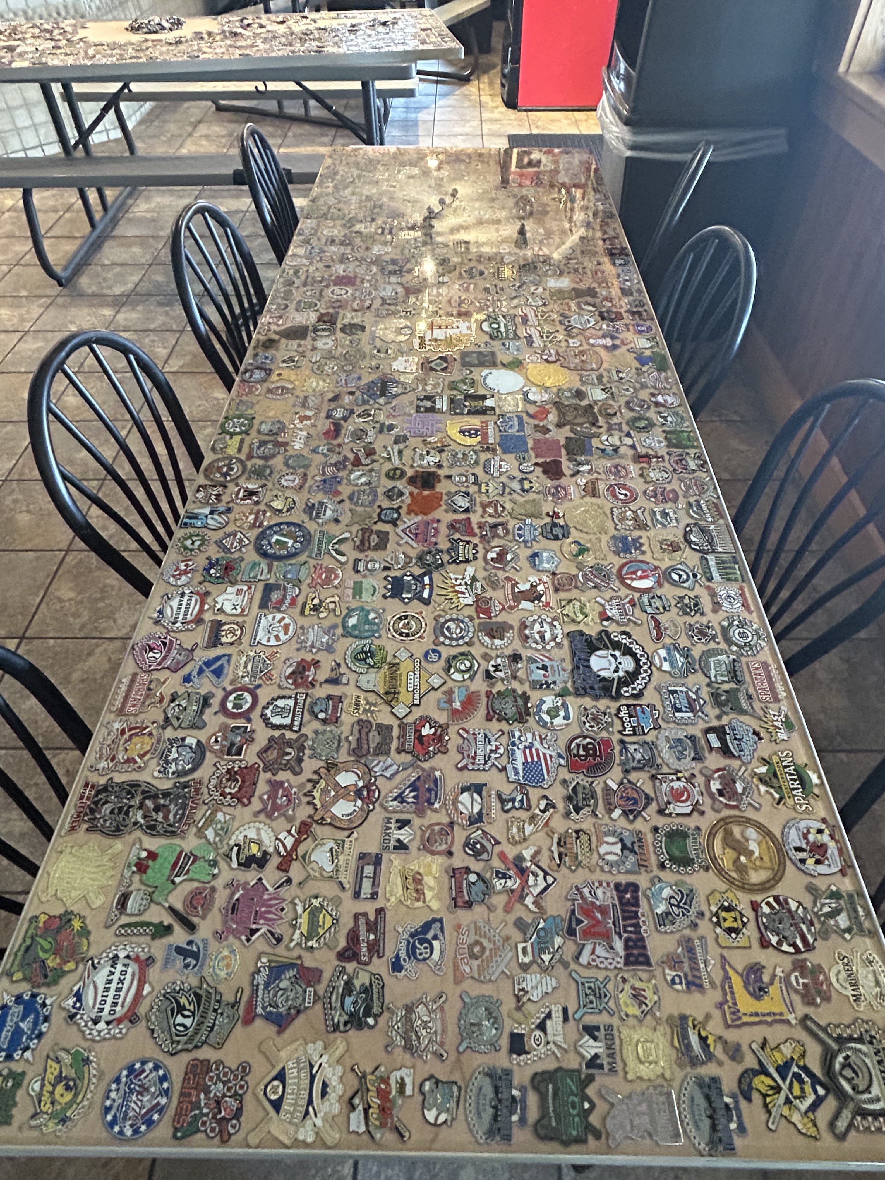 Table covered in trading pins