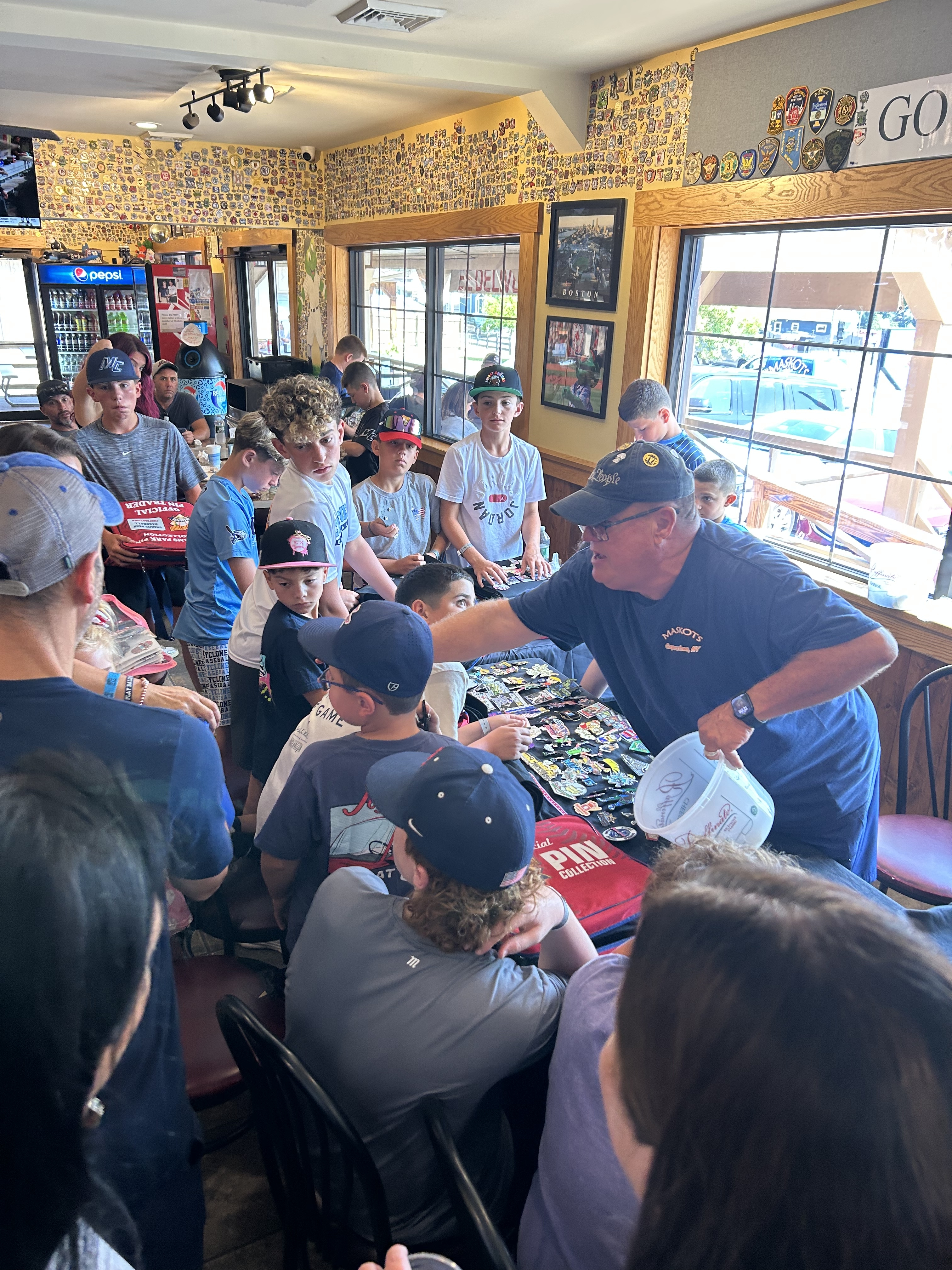 Kids showing off their pin collections