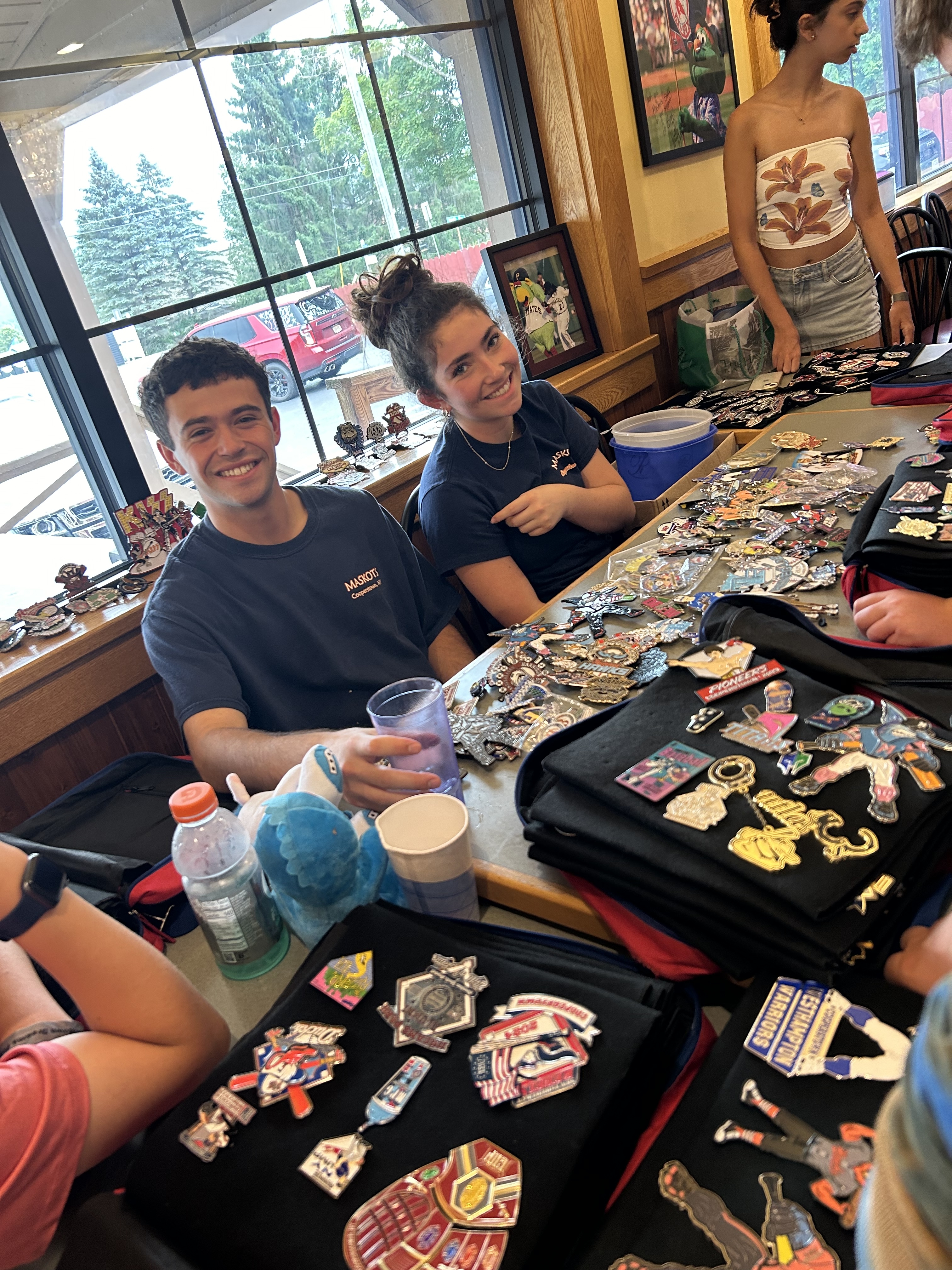 Kids trading baseball pins at Maskots